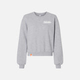 Pull en molleton à col rond American Apparel, couleur neutre, porté sur mannequin, détail du tissu doux et confortable.