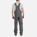 Salopette de travail extensible Carhartt, vêtement robuste avec zones de mouvement, en tissu résistant et pratique pour le travail.