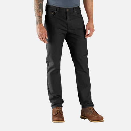 Pantalon Rugged Flex Duck Carhartt en denim robuste avec coupe décontractée et détails renforcés pour le travail.