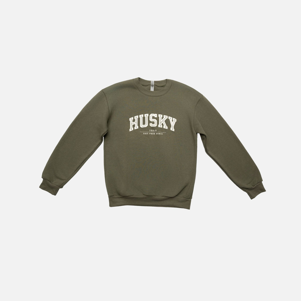 Chandail à col rond HUSKY de la collection L'Essentiel, vêtement chaud en laine bleu avec détail discret.