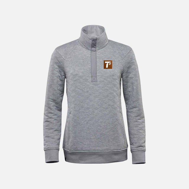 Pull thermique gris à col quarter-zip pour femme de la marque Stormtech, tissu chaud et confortable.