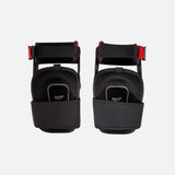Genouillères stabilisatrices noires Milwaukee avec sangle de cuisse, accessoires de protection individuelle pour le travail.