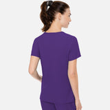 Haut d’uniforme MedCouture avec poche latérale en tissu souple, design confortable pour vêtements professionnels.