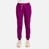 Pantalon jogger médical MedCouture en tissu extensible, couleur prune royale, avec poches pratiques, pour uniformes professionnels.