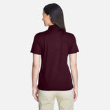 Polo femme Core365 performance Origin en marron, vêtement polo pour femmes, style sportif et confortable.