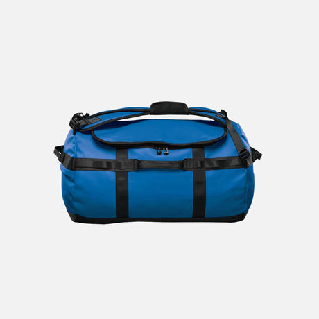 Sac 2-en-1 Stormtech, sac de voyage imperméable et polyvalent, en bleu, combinant duffel et sac à dos pour accessoires-sacs.