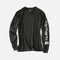 T-shirt manches longues Carhartt en coton épais noir avec logo sur la manche, vêtement de style décontracté.