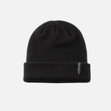 Tuque à revers noire DML Creation, vêtement chaud en laine avec revers, vue en gros plan sur le logo DML.