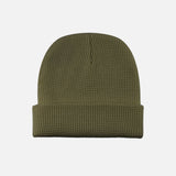 Tuque gaufrée avec revers verte de DML Creation, vêtement chaud et élégant pour l'hiver, en matière douce et texturée.